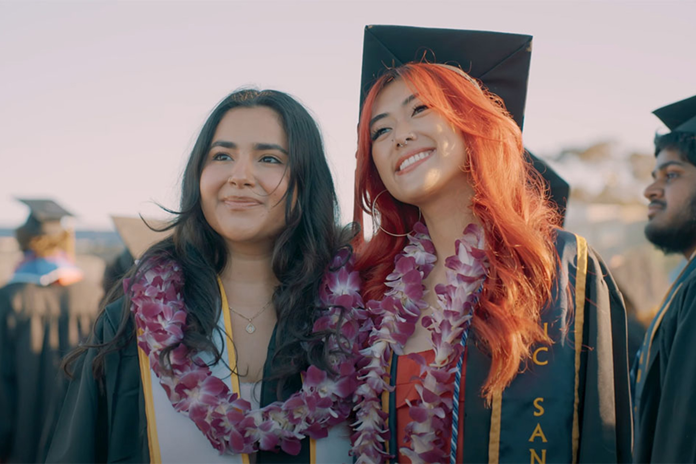 2 people smiling after graduation